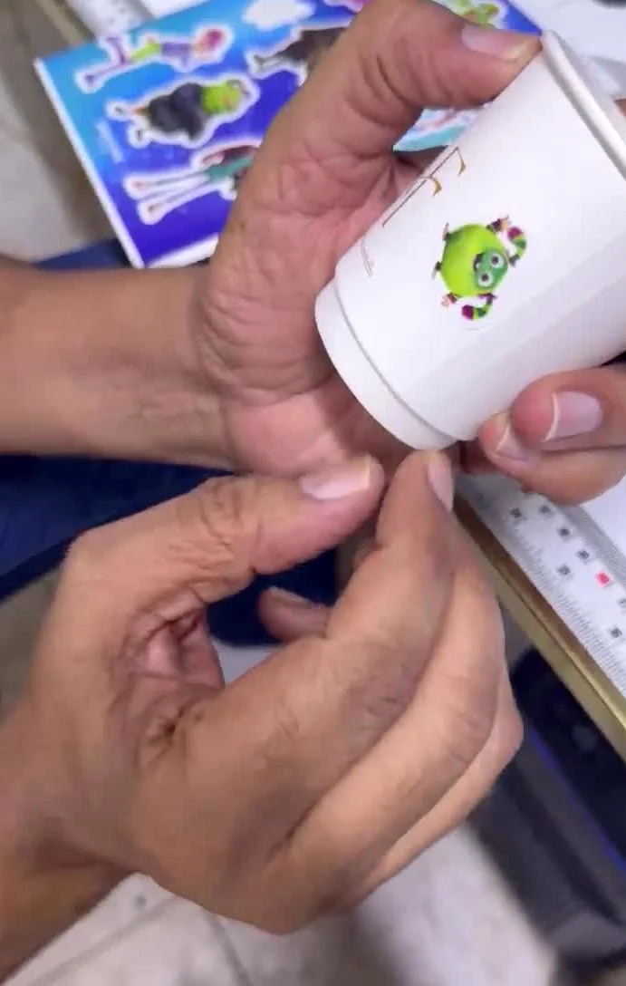 Product label application on a cup